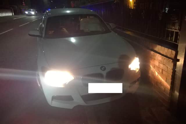 The BMW which was pursued by police before crashing into another vehicle
