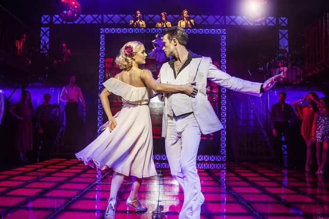 Kate Parr (Stephanie) and Richard Winsor (Tony) in an iconic scene from Saturday Night Fever. Picture: Pamela Raith Photography