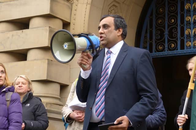 Shaffaq Mohammed giving a speech outside Sheffield town hall.