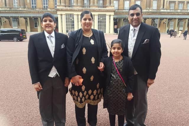 Shaffaq Mohammed with his family at Buckingham palace collecting his MBE.