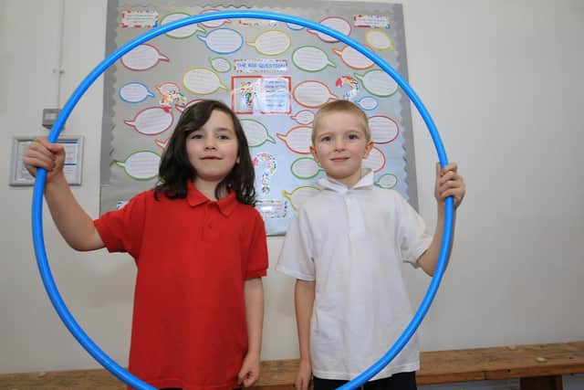 Pictured are Max aged seven, and Isabella aged seven taking part in sports day.