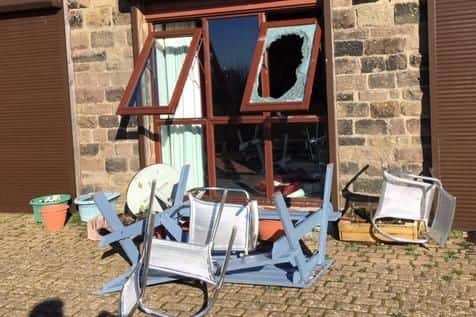 The window was smashed with a brick and benches and chairs were broken