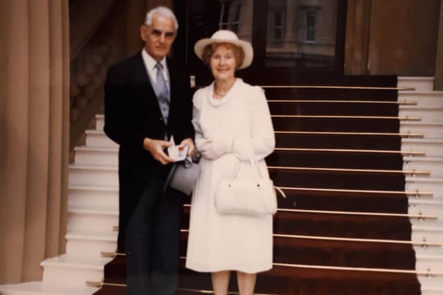Collecting his MBE at the Palace.