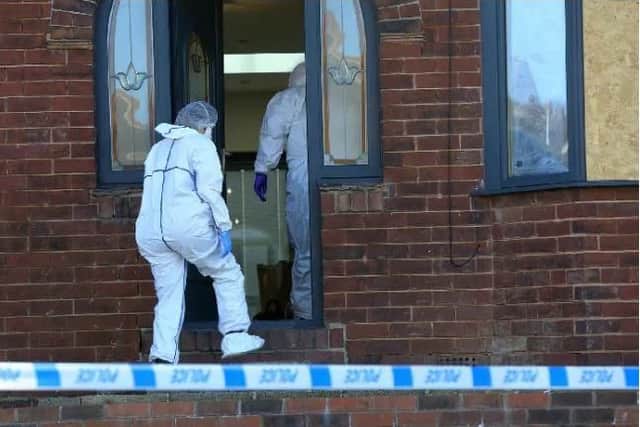Forensics officers examined a house in Sheffield where a man was shot on Tuesday night