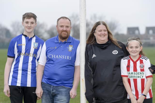 Stuart and Marie Hudson from Aston who are split over the upcoming derby game between the Blades and the Owls along with daughter Grace and son Rhys. Picture: Dean Atkins