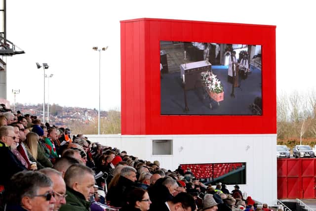 Mourners watch the funeral service for Gordon Banks on the big screens at the bet365 Stadium, Stoke. Picture: Aaron Chown/PA Wire