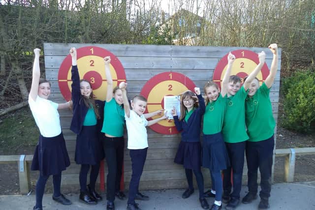 (L-R) Juno 10, Aimee 11, Niamh 11, Mac 10, Connie 10, Daisy 11, Zak 11, Ollie 11 celebrating the recent Ofsted rating