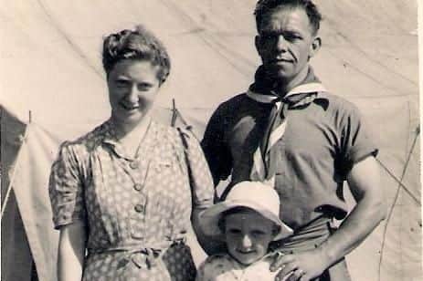 Robert Grant, aged around five, with his parents Cyril and Hilda at a scout camp in about 1947