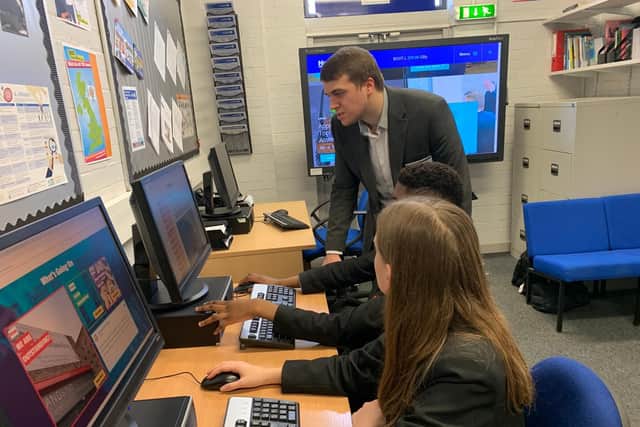 Dan Boot, Communications Coordinator for Henry Boot talking to Year 10 students Djessy Kihuyu and Sophie Fuller at the launch of the careers hub
