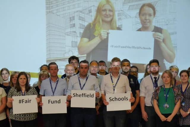 Staff at All Saints Roman Catholic High School show their support the Fair Fund Sheffield Schools campaign