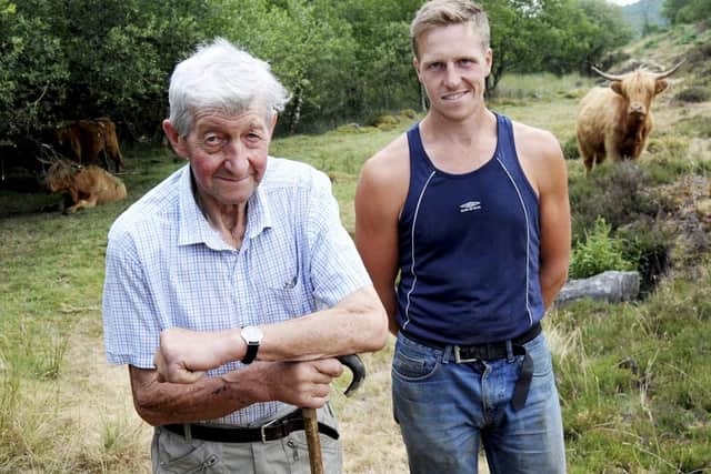 Farmers, Alex Birch with his grandfather, David Thorp, at the Baslow Edge site where their Highland cattle grazed.