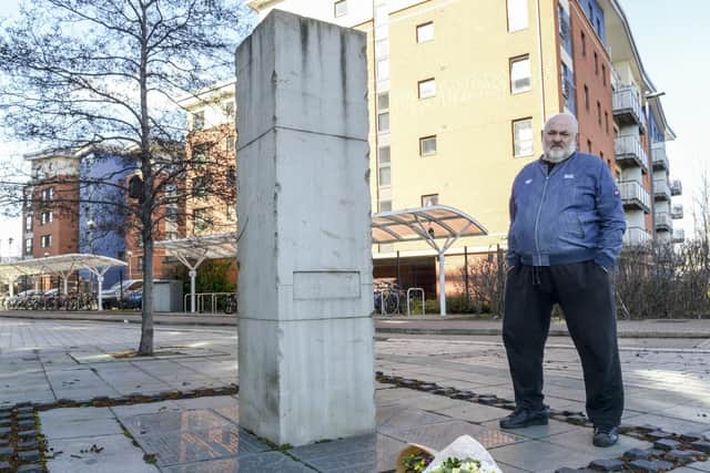 Ron Clayton alongside the Sheffield Flood Memorial at Millsands in the city.
