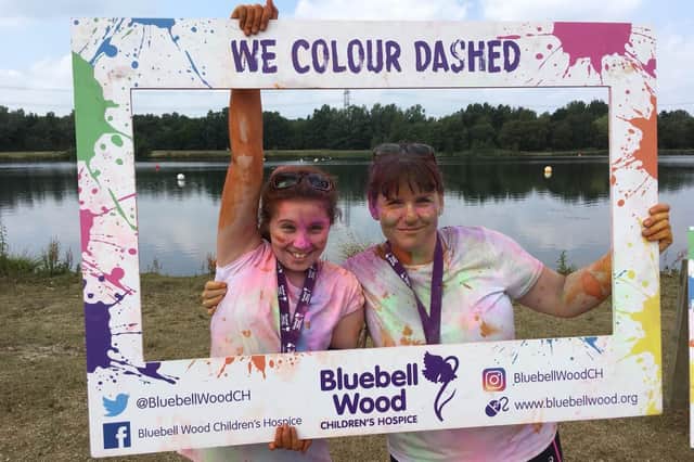 Diane Matthews (right) pictured with her daughter Florence after completing the Bluebell Wood Children's Hospice Colour Dash
