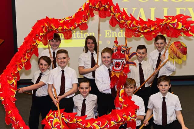 Year seven children pictured learning the Dragon Dance.