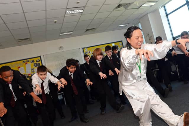 Year seven children pictured learning Tai Chi.