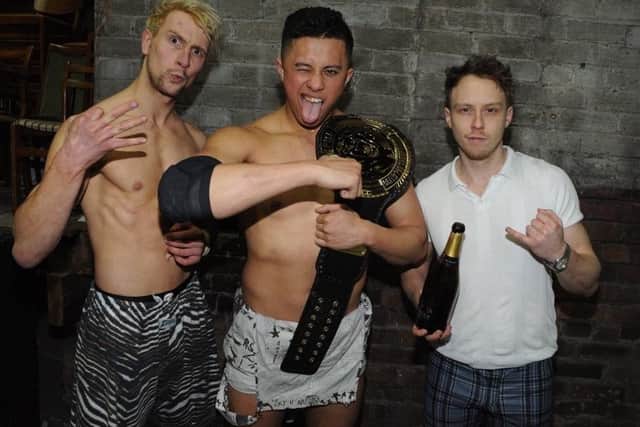 Breed champion TK Cooper (centre) with fellow wrestlers Chuck Mambo (left) and Spike Trivet (right)
