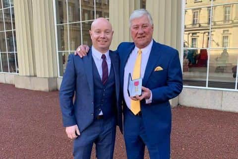 Rotherham United chairman Tony Stewart (right) with his OBE. He is pictured with the club's vice chairman Richard Stewart. Picture: Rotherham United.