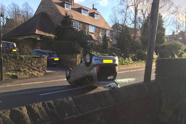 A car on its roof following a crash on Psalter Lane in Brincliffe, Sheffield
