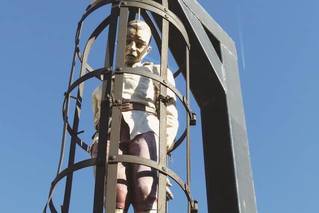 A replica of the figure of Spence Broughton hanging on a gibbet