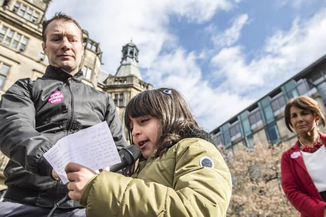 Year 2 pupil Malak with Headteacher Ian Read reading out her letter to Damian Hinds MP
