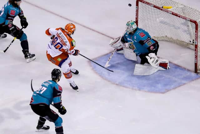 Belfast Giants' Tyler Beskorowany with Sheffield Steelers' John Armstrong during Sunday's Elite Ice Hockey League game at the SSE arena.  Photo by William Cherry/Presseye