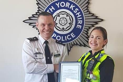 PC Keeley Lees receives her Chief Constable commendation from Chief Insp Chris Foster