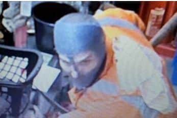 Robbers armed with a hammer and pickaxe raided a Sheffield supermarket