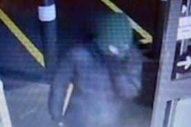 Two armed robbers are wanted by South Yorkshire Police after a supermarket raid in Sheffield