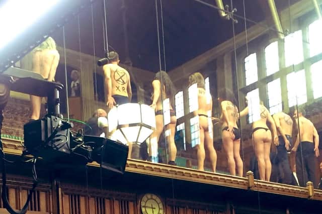 Naked protesters storm Parliament. (Photo: Caroline Flint).