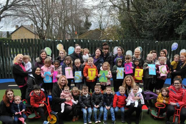 Staff and children at Sunny Meadows Nursery celebrating the 'outstanding' judgement
