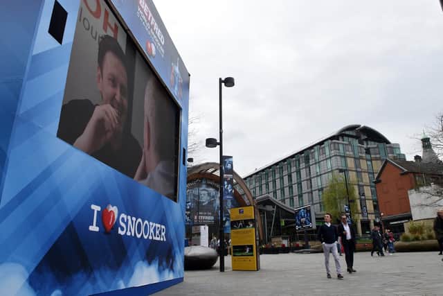 Television screens in Tudor Square for the World Snooker Championships.