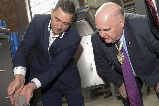 Straaltechniek UK's managing director Andy Allen shows Master Cutler Nick Cragg one of the blasting machines in the workshop for a refurb at the firm's Sheffield HQ