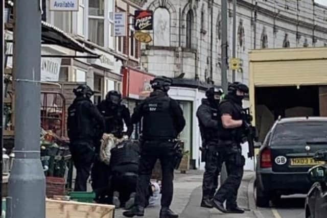 Officers in Abbeydale Road yesterday.