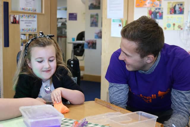 Chloe Griffin, aged seven, loved making sticky slime with footballer Will Vaulks during one of her short breaks at the hospice.