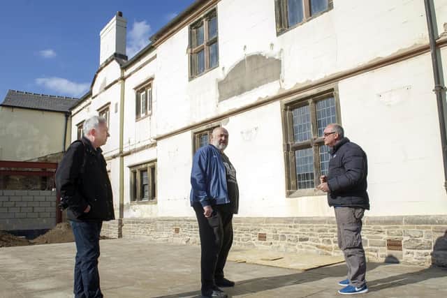 Dave Pickersgill, Ron Clayton and Sean Fogg outside Carbrook Hall, which is being restored ahead of its conversion to a drive-thru Starbucks cafe