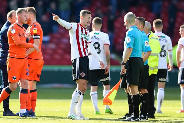 Paul Coutts remonstrates with referee David Webb: James Wilson/Sportimage