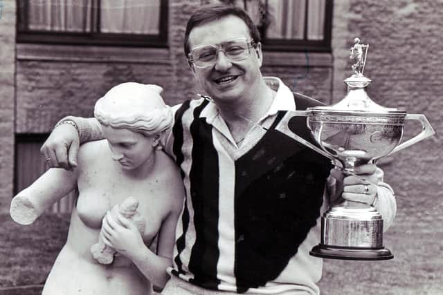 Dennis Taylor celebrates his 1985 win - with a somewhat risque statue!