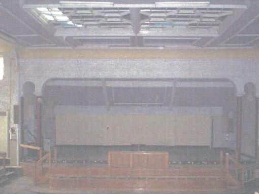 Inside the old Salvation Army Citadel building in Sheffield city centre. View of the stage on the first floor