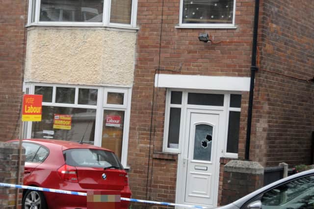 Bullet holes could be seen in the window of the front door of the home of Coun Mohammad Maroof on Edgedale Road, Nether Edge, overnight. Picture: Sam Cooper / The Star