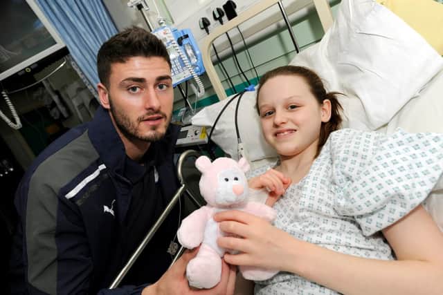 Six years ago: Sheffield Wednesday's first team squad visited the Sheffield Childrens Hospital.. and then-player Gary Madine presented Tia McGarry with a Teddy Bear