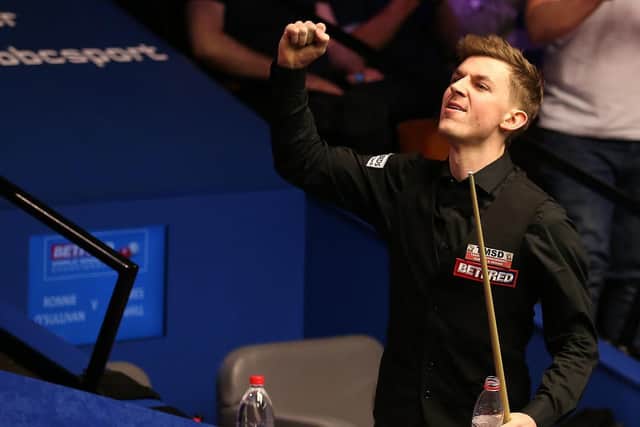 James Cahill celebrates after beating Ronnie O'Sullivan 10-8 during day four of the 2019 Betfred World Championship at The Crucible, Sheffield. Picture: Nigel French/PA Wire