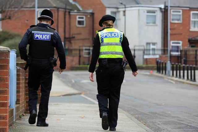 Sergeant Mike Miles and PC Nicky Dewhurst on patrol around Eastwood in Rotherham. Picture: Chris Etchells