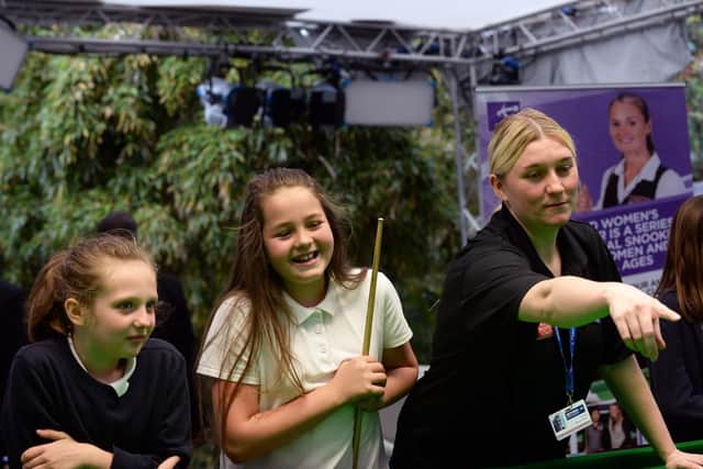 Snooker Women's Day at Sheffield Winter Garden. Pictured is women's world number three Rebecca Kenna giving instuction to pupils from Spire Junior School, Chestefield. Picture: Steve Ellis