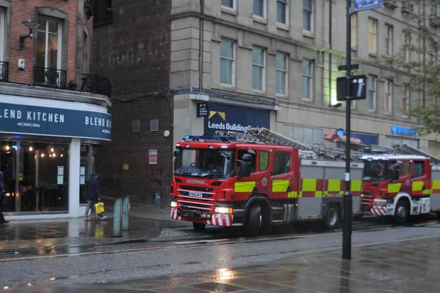Firefighters on Pinstone Street, Sheffield. Picture and video: Sam Cooper / The Star