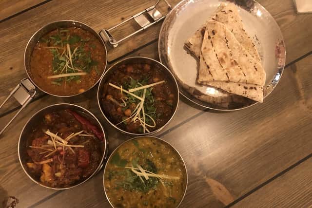 Our curries were served in neat tins and mopped up with roti bread