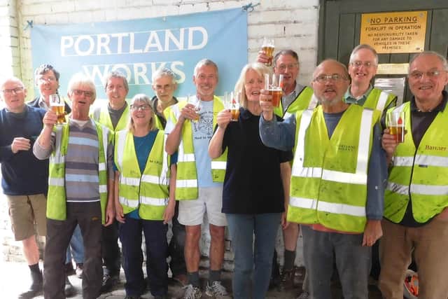 Volunteers at Portland Works take a break to toast the 140th anniversary with a special Anniversary Ale produced by Neepsend Brewery in Sheffield