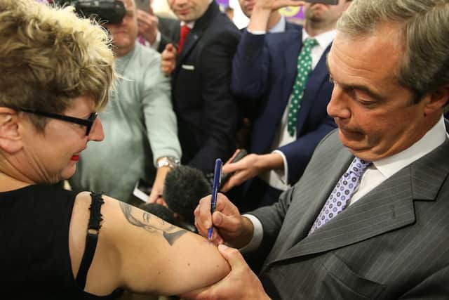 Kerry Webb has the face of former UKIP leader Nigel Farage inked on her arm - and had it signed when she met him in Doncaster.
