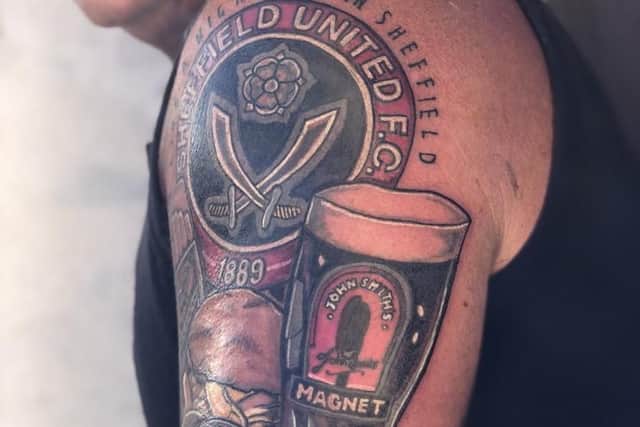 This devout Sheffield United fan had a tribute to the club's famous Greasy Chip Butty Song on his arm.