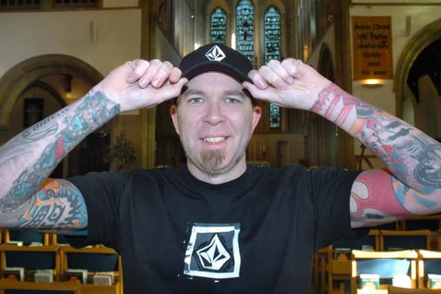 The Reverend Andy Rushworth shows off his tats at All Saints Church, Ringinglow in 2005.