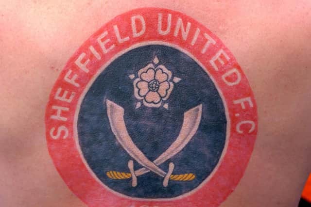 One Blades fan got a huge tattoo of the club's badge on his back.